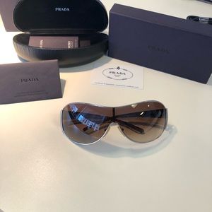 Brand new never used Prada sunglasses authentic.